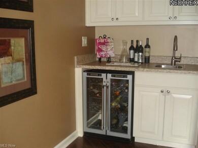Wet bar is part of family room with wine & drink chiller.