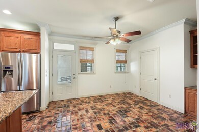 The Breakfast Area/Keeping room is open to the Kitchen and has a ceiling fan and brick pavers.
