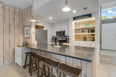 Kitchen featuring appliances with stainless steel