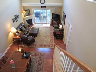 Den. Loft view of the living room and dining room
