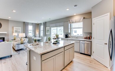 The large open concept main level makes for a great abode. *Staged Model photo, actual selections and options may vary.