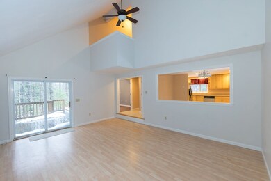 Kitchen open to living room by a half wall.  Slide