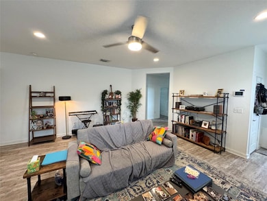 Living room featuring wood finished floors, ceili
