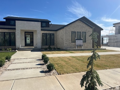View of front of house with a front yard