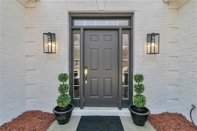 Entrance to property with brick siding