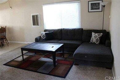 Open living room with exposed beam ceilings