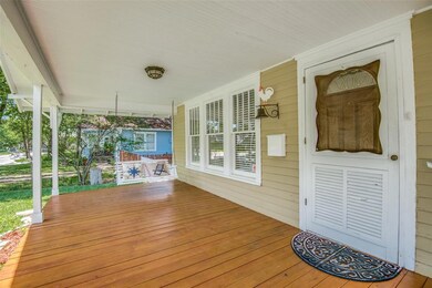 BEAUTIFUL STAINED WOOD FRONT PORCH, AND A PORCH SW