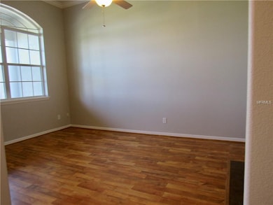 Living Room with Tray Ceilings and Crown Molding.