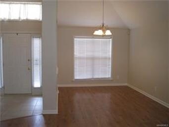 View of the Front Door, Foyer, and Dining room.