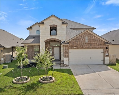 French provincial home with brick siding, a shingl