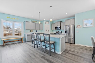 Kitchen with pendant lighting, a breakfast bar, ap