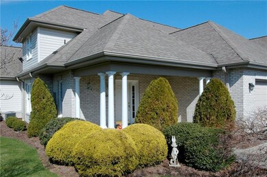 The multi level roof and columns on the covered fr