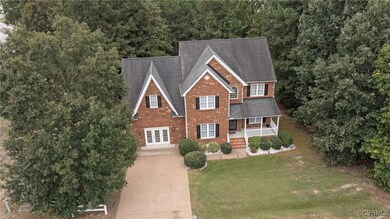 View of front of home with a front lawn and covere