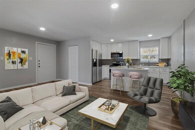 Digitally staged photo of family room and kitchen 