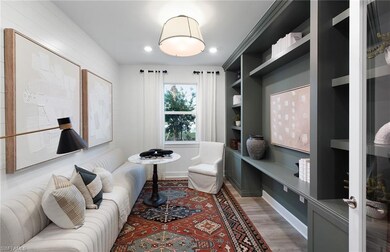 Living room featuring built in features and hardwo