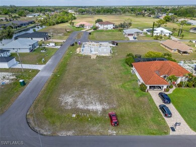 Bird's eye view featuring a water view and a resid