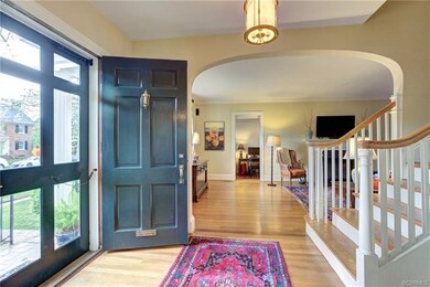 The foyer showcases the wide stairway and wide ope