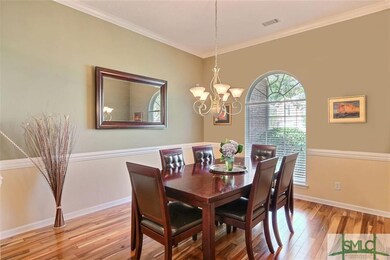 Formal Dining Room with wood floors and elegant mo