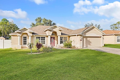Ranch-style house featuring stucco siding, concrete driveway, an attached garage, and a shingled roof