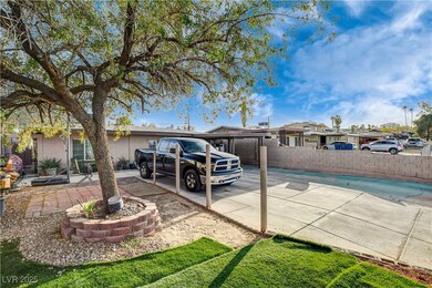 Back of house featuring fence and stucco siding