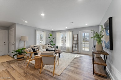 Great room with recessed lighting and lvt flooring