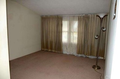 Master bedroom with vaulted ceilings.