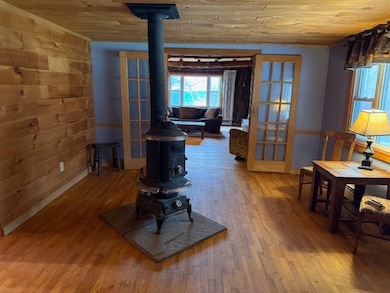Pot belly woodstove in entry