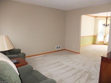 Living room opens into formal dining room.