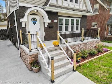 Property entrance featuring brick siding