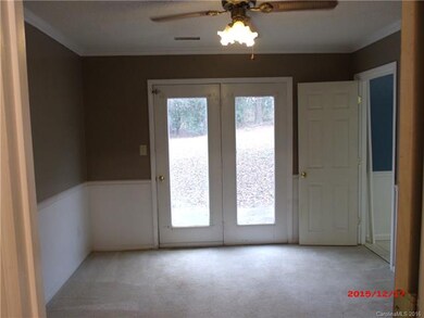 Dining room with door to patio and door to kitchen