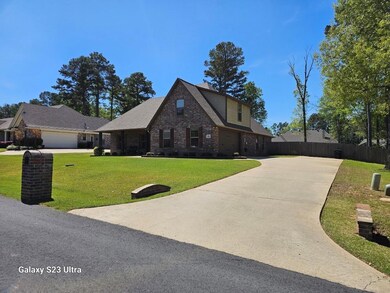 View of front of house with a front lawn and a gar