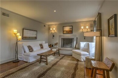 The living room features original hardwood floors 