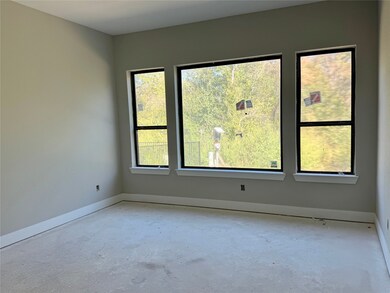 Main Bedroom with Large windows no neighborhoods behind