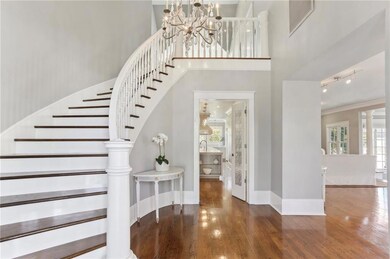 Grand foyer with Sweeping Staircase and Crystal Ch