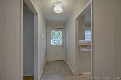 Welcoming entryway with coat closet.