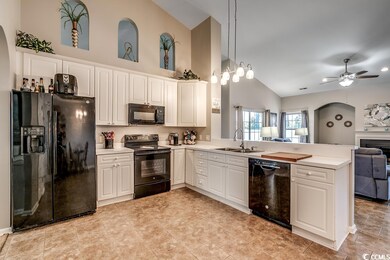 Open concept kitchen and great room with vaulted c