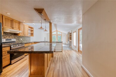 Kitchen with recessed lighting.