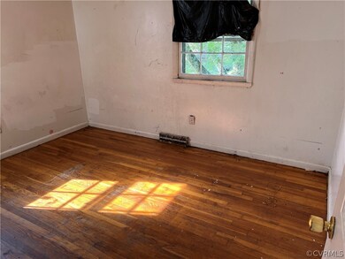 Empty room featuring hardwood / wood-style floors