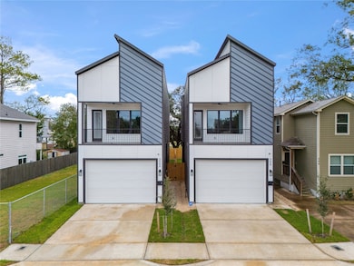 Spacious driveway, inviting balcony, and large win