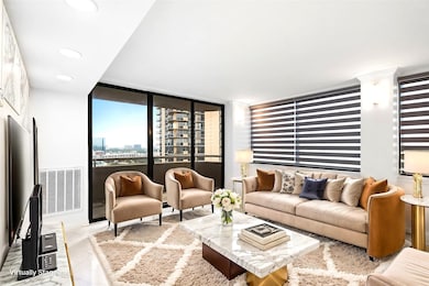 This modern living room features large windows wit