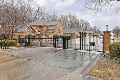 View of gate featuring fence