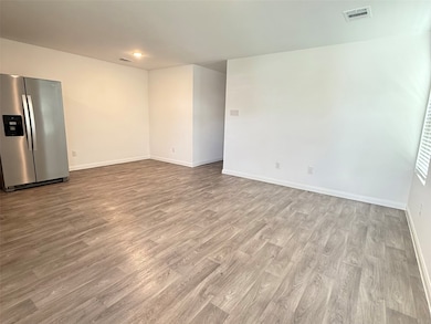 Living room/ breakfast are next to refrigerator