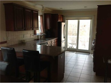 Kitchen. Sunny backyard.