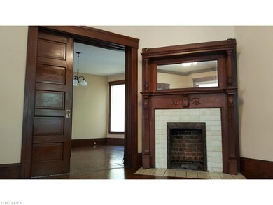 The feature-rich living room has fireplace with or