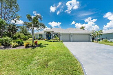 Beautifully painted oversized driveway for all your guests has decorative trim and a 3-car garage