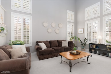 Living room featuring baseboards, plenty of natura