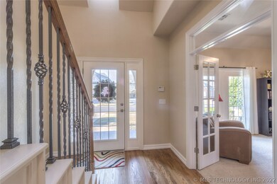Bright entry, wood floors and Study to the left as
