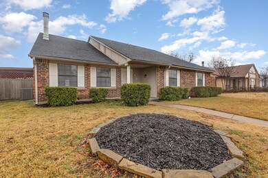 Ranch-style house featuring central AC and a front