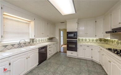 Kitchen with access to the formal dining room