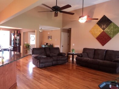 The home as been custom built with an open floor plan for the Living Room, Kitchen, Dining Room and Breakfast.  Finished Wood Hardwood through out all areas.